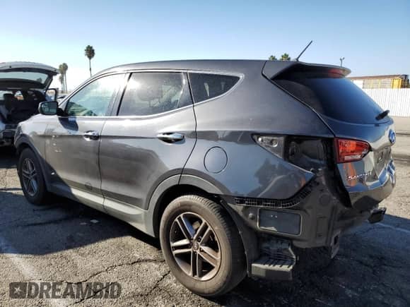 2018 Hyundai Santa Fe 2.4L with VIN 5XYZT3LB2JG509984, listed as a Copart auction lot 85510595 with 103,988 mi miles and Salvage title. Bid and sale history available at DreamBid. Image 2.