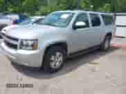 2014 Chevrolet Suburban LT z VIN 1GNSCJE07ER241238, wystawiony jako IAAI lot #42280316 z przebiegiem 168 704 mil mil oraz . Historia ofert i sprzedaży dostępna na DreamBid. Obrazek 20.