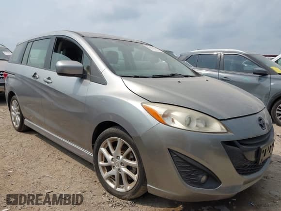 ✅ 2012 Mazda 5 Grand Touring • VIN: JM1CW2DL1C0126545 • Lot: 42301130. Listed on IAAI with 151,212 mi. Free auction sales archive from the USA and detailed vehicle history report at DreamBid. Image 1.