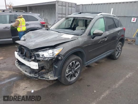 ✅ 2016 Mazda CX-5 Grand Touring • VIN: JM3KE4DY2G0763608 • Lot: 43864275. Wystawiony na IAAI z przebiegiem 95 452 mil. Bezpłatny archiwum sprzedaży aukcyjnych z USA i szczegółowy raport historii pojazdu na DreamBid. Zdjęcie 2.