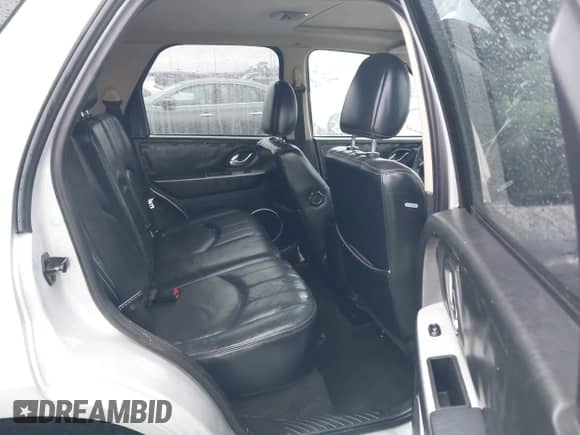 2005 Mercury Mariner Luxury z VIN 4M2CU561X5DJ16539, wystawiony jako IAAI lot #41572981 z przebiegiem 157 461 mil mil oraz . Historia ofert i sprzedaży dostępna na DreamBid. Obrazek 8.