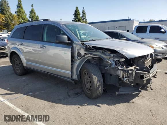 2017 Dodge Journey SE with VIN 3C4PDCAB1HT569099, listed as a Copart auction lot 85314065 with 143,721 mi miles and Salvage title. Bid and sale history available at DreamBid. Image 4.