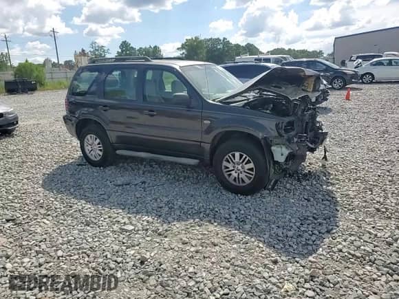 2006 Mercury Mariner Convenience z VIN 4M2YU56Z86DJ00448, wystawiony jako Copart lot #65950725 z przebiegiem 167 854 mil mil oraz Szkoda całkowita • Salvage title. Historia ofert i sprzedaży dostępna na DreamBid. Obrazek 13.