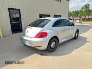 ✅ 2013 Volkswagen Beetle 2.5L • VIN: 3VWJX7AT3DM663774 • Lot: 85182775. Listed on Copart with 100,016 mi. Free auction sales archive from the USA and detailed vehicle history report at DreamBid. Image 4.