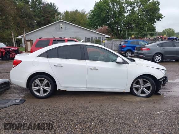 2012 Chevrolet Cruze 2LT z VIN 1G1PG5SC0C7180406, wystawiony jako IAAI lot #43393854 z przebiegiem 143 467 mil mil oraz . Historia ofert i sprzedaży dostępna na DreamBid. Obrazek 14.