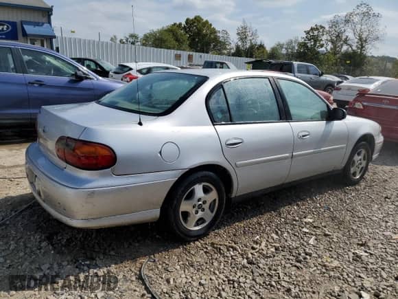 2003 Chevrolet Malibu with VIN 1G1ND52J53M700194, listed as a Copart auction lot 72454574 with 136,497 mi miles and Salvage title. Bid and sale history available at DreamBid. Image 3.