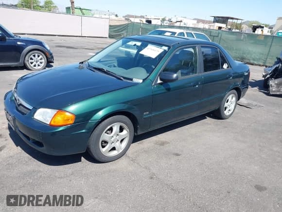 ✅ 2000 Mazda Protege ES • VIN: JM1BJ2211Y0238359 • Lot: 42368475. Listed on IAAI with 80,554 mi. Free auction sales archive from the USA and detailed vehicle history report at DreamBid. Image 2.