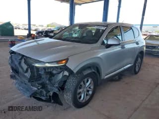 ✅ 2019 Hyundai Santa Fe SE • VIN: 5NMS23AD0KH066718 • Лот: 84984575. Опубликован ранее на Copart с пробегом 103 824 миль. Бесплатный доступ к архиву аукционных продаж из США и подробный отчёт об истории автомобиля на DreamBid. Изображение 1.