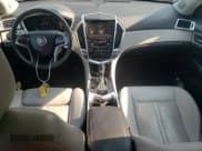 ✅ 2015 Cadillac SRX Premium Collection • VIN: 3GYFNGE38FS598583 • Лот: 70913325. Опубликован ранее на Copart с пробегом 121 230 миль. Бесплатный доступ к архиву аукционных продаж из США и подробный отчёт об истории автомобиля на DreamBid. Изображение 8.