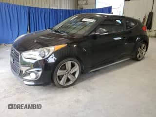 2014 Hyundai Veloster Turbo z VIN KMHTC6AE8EU184519, wystawiony jako Copart lot #69516205 z przebiegiem 151 680 mil mil oraz Czysty tytuł • Clean title. Historia ofert i sprzedaży dostępna na DreamBid. Obrazek 1.
