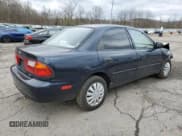 ✅ 1998 Mazda Protege DX • VIN: JM1BC1411W0238344 • Lot: 63596295. Listed on Copart with 74,052 mi. Free auction sales archive from the USA and detailed vehicle history report at DreamBid. Image 3.