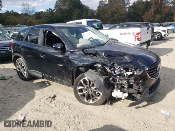 ✅ 2016 Mazda CX-5 Grand Touring • VIN: JM3KE4DY9G0764433 • Lot: 82728825. Wystawiony na Copart z przebiegiem 166 905 mil. Bezpłatny archiwum sprzedaży aukcyjnych z USA i szczegółowy raport historii pojazdu na DreamBid. Zdjęcie 4.