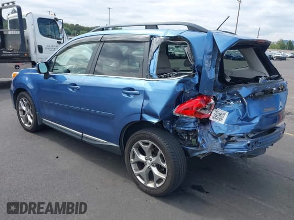 ✅ 2015 Subaru Forester Touring • VIN: JF2SJAWC8FH597570 • Lot: 43185804. Listed on IAAI with 116,334 mi. Free auction sales archive from the USA and detailed vehicle history report at DreamBid. Image 3.