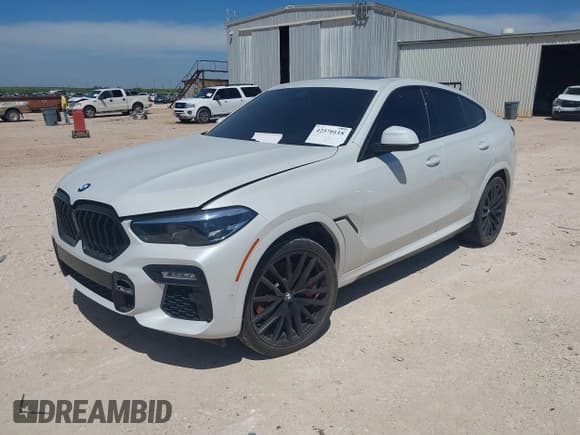 ✅ 2021 BMW X6 M50i • VIN: 5UXCY8C02M9H19933 • Лот: 42570118. Опубликован ранее на IAAI с пробегом 73 648 миль. Бесплатный доступ к архиву аукционных продаж из США и подробный отчёт об истории автомобиля на DreamBid. Изображение 2.
