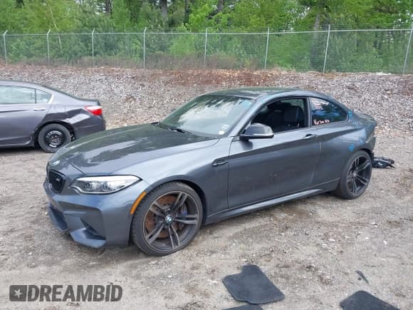 ✅ 2018 BMW M2 • VIN: WBS1J5C57JVA12779 • Lot: 42256014. Listed on IAAI with 77,093 mi. Free auction sales archive from the USA and detailed vehicle history report at DreamBid. Image 2.