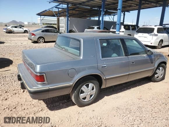 ✅ 1991 Dodge Dynasty LE • VIN: 1B3XC56R9MD115785 • Lot: 48073715. Listed on Copart with 64,483 mi. Free auction sales archive from the USA and detailed vehicle history report at DreamBid. Image 3.