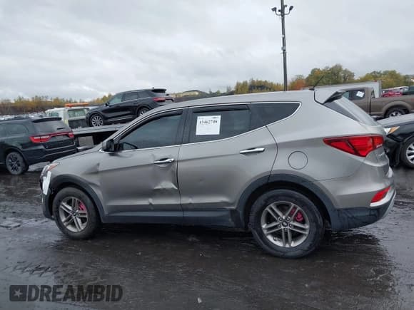 ✅ 2018 Hyundai Santa Fe 2.4L • VIN: 5NMZTDLB2JH095519 • Лот: 43462708. Опубликован ранее на IAAI с пробегом 87 498 миль. Бесплатный доступ к архиву аукционных продаж из США и подробный отчёт об истории автомобиля на DreamBid. Изображение 14.