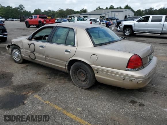 ✅ 1998 Ford Crown Victoria • VIN: 2FAFP73W0WX162676 • Lot: 71668134. Listed on Copart with 106,167 mi. Free auction sales archive from the USA and detailed vehicle history report at DreamBid. Image 2.