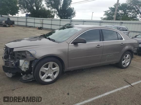 ✅ 2011 Chevrolet Malibu 1LS • VIN: 1G1ZB5E12BF232415 • Lot: 65534654. Listed on Copart with 110,594 mi. Free auction sales archive from the USA and detailed vehicle history report at DreamBid. Image 1.