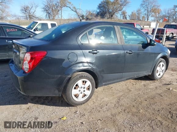 ✅ 2014 Chevrolet Sonic LS • VIN: 1G1JA5SH0E4214903 • Lot: 43633449. Listed on IAAI with 68,732 mi. Free auction sales archive from the USA and detailed vehicle history report at DreamBid. Image 4.