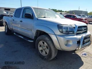 ✅ 2010 Toyota Tacoma PreRunner • VIN: 3TMKU4HN5AM026256 • Lot: 43631897. Listed on IAAI with 435,053 mi. Free auction sales archive from the USA and detailed vehicle history report at DreamBid. Image 1.