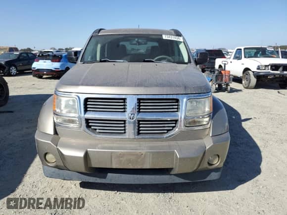 2007 Dodge Nitro SLT z VIN 1D8GT58K17W733840, wystawiony jako Copart lot #73431434 z przebiegiem 218 353 mil mil oraz Szkoda całkowita • Salvage title. Historia ofert i sprzedaży dostępna na DreamBid. Obrazek 5.