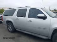 ✅ 2010 Chevrolet Suburban LT • VIN: 1GNUCJE03AR238548 • Lot: 42104596. Listed on IAAI with 153,959 mi. Free auction sales archive from the USA and detailed vehicle history report at DreamBid. Image 13.