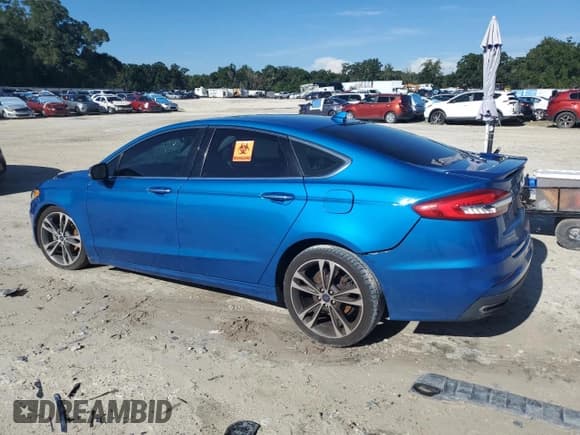 ✅ 2019 Ford Fusion Titanium • VIN: 3FA6P0K96KR260185 • Lot: 68269165. Listed on Copart with 135,105 mi. Free auction sales archive from the USA and detailed vehicle history report at DreamBid. Image 2.