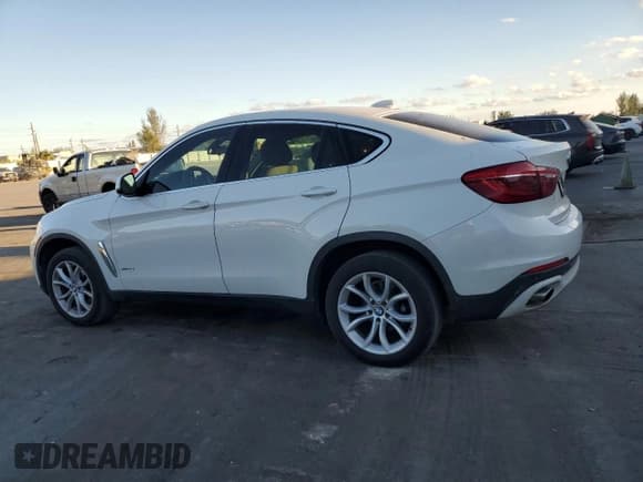 ✅ 2015 BMW X6 xDrive35i • VIN: 5UXKU2C54F0F95994 • Lot: 93351645. Listed on Copart with 164,540 mi. Free auction sales archive from the USA and detailed vehicle history report at DreamBid. Image 2.