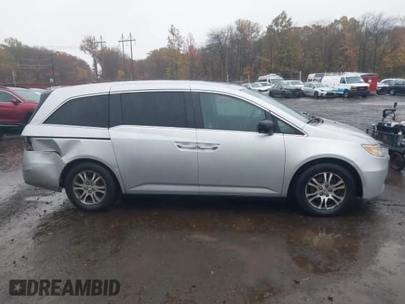 ✅ 2011 Honda Odyssey EX-L • VIN: 5FNRL5H65BB026134 • Lot: 43580374. Listed on IAAI with 149,429 mi. Free auction sales archive from the USA and detailed vehicle history report at DreamBid. Image 13.
