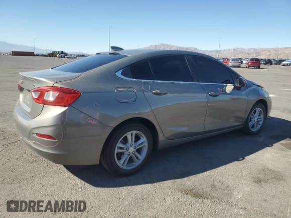 ✅ 2017 Chevrolet Cruze LT • VIN: 1G1BE5SM2H7210036 • Lot: 90130525. Listed on Copart with 66,230 mi. Free auction sales archive from the USA and detailed vehicle history report at DreamBid. Image 3.
