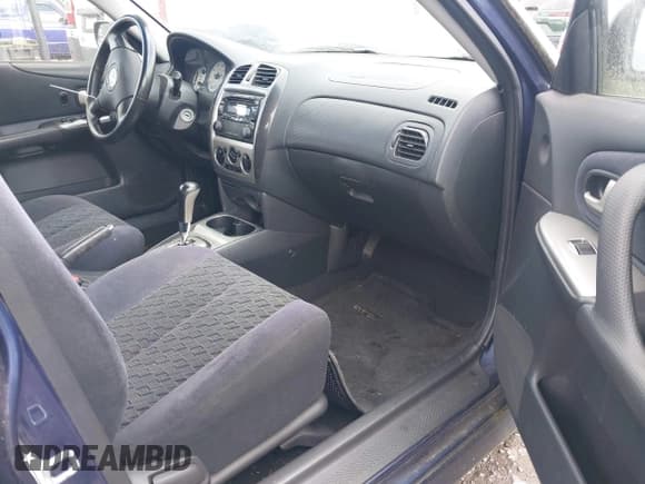 ✅ 2003 Mazda Protege • VIN: JM1BJ245031117566 • Lot: 42349853. Wystawiony na IAAI z przebiegiem 152 784 mil. Bezpłatny archiwum sprzedaży aukcyjnych z USA i szczegółowy raport historii pojazdu na DreamBid. Zdjęcie 5.