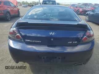 ✅ 2007 Hyundai Tiburon GT • VIN: KMHHN66F97U256039 • Лот: 82313705. Опубликован ранее на Copart с пробегом 151 935 миль. Бесплатный доступ к архиву аукционных продаж из США и подробный отчёт об истории автомобиля на DreamBid. Изображение 6.
