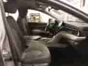 2021 Toyota Camry Hybrid LE with VIN 4T1C31AKXMU027792, listed as a IAAI auction lot 42012242 with 53,397 mi miles and . Bid and sale history available at DreamBid. Image 5.