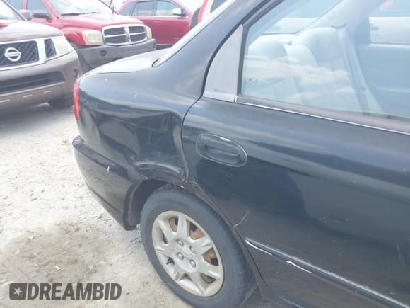 ✅ 2003 Kia Spectra • VIN: KNAFB121535246949 • Lot: 42402307. Listed on IAAI with 98,678 mi. Free auction sales archive from the USA and detailed vehicle history report at DreamBid. Image 6.