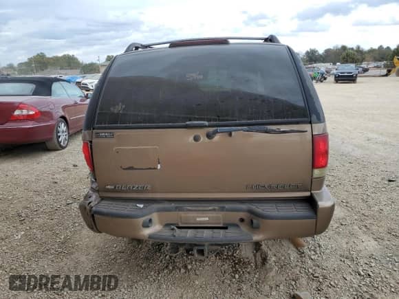 2002 Chevrolet Blazer LS z VIN 1GNDT13W42K216527, wystawiony jako Copart lot #78736754 z przebiegiem 212 774 mil mil oraz Szkoda całkowita • Salvage title. Historia ofert i sprzedaży dostępna na DreamBid. Obrazek 6.