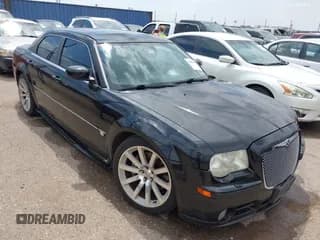 ✅ 2006 Chrysler 300 C SRT-8 • VIN: 2C3LA73W26H346661 • Lot: 42990681. Listed on IAAI with 129,580 mi. Free auction sales archive from the USA and detailed vehicle history report at DreamBid. Image 1.