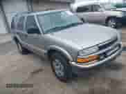 1999 Chevrolet Blazer LT z VIN 1GNDT13W3X2250496, wystawiony jako IAAI lot #42001807 z przebiegiem 210 193 mil mil oraz . Historia ofert i sprzedaży dostępna na DreamBid. Obrazek 1.