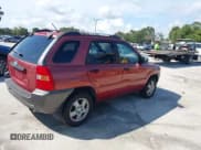 ✅ 2006 Kia Sportage LX • VIN: KNDJF724467264656 • Lot: 42751457. Listed on IAAI with 153,292 mi. Free auction sales archive from the USA and detailed vehicle history report at DreamBid. Image 4.