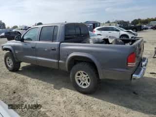 2002 Dodge Dakota SLT z VIN 1B7HG48N82S639319, wystawiony jako Copart lot #89595265 z przebiegiem Nie podano mil oraz Czysty tytuł • Clean title. Historia ofert i sprzedaży dostępna na DreamBid. Obrazek 2.