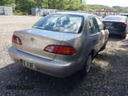 ✅ 1999 Toyota Corolla VE • VIN: 2T1BR12E1XC141396 • Lot: 42969365. Listed on IAAI with 215,831 mi. Free auction sales archive from the USA and detailed vehicle history report at DreamBid. Image 4.