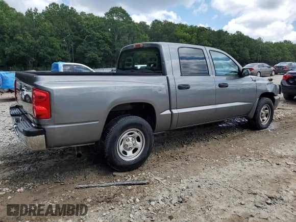2006 Dodge Dakota SLT с VIN 1D7HE48K06S522552, выставлен на аукционе Copart как лот 67614475 с пробегом 208 801 миль миль и Списание • Salvage title. История ставок и продаж доступна на DreamBid. Изображение 3.