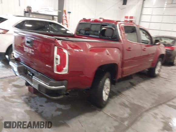 ✅ 2018 GMC Canyon 4WD SLE • VIN: 1GTG6CEN1J1174643 • Лот: 43660608. Опубликован ранее на IAAI с пробегом 83 972 миль. Бесплатный доступ к архиву аукционных продаж из США и подробный отчёт об истории автомобиля на DreamBid. Изображение 4.
