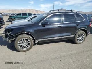 ✅ 2015 Volkswagen Touareg Executive • VIN: WVGEP9BP4FD008048 • Lot: 75273624. Listed on Copart with 100,919 mi. Free auction sales archive from the USA and detailed vehicle history report at DreamBid. Image 1.