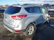 ✅ 2016 Ford Escape SE • VIN: 1FMCU9G98GUA28086 • Lot: 43667528. Listed on IAAI with 27,553 mi. Free auction sales archive from the USA and detailed vehicle history report at DreamBid. Image 4.
