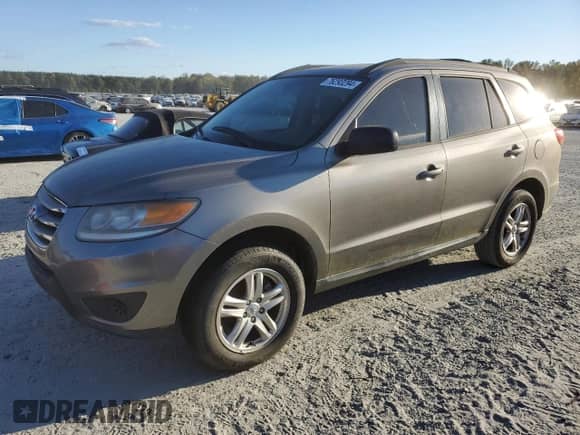 2012 Hyundai Santa Fe GLS z VIN 5XYZG3AB0CG122036, wystawiony jako Copart lot #76293294 z przebiegiem 182 407 mil mil oraz Czysty tytuł • Clean title. Historia ofert i sprzedaży dostępna na DreamBid. Obrazek 1.