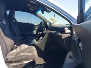 2022 Hyundai Veloster with VIN KMHT36AH0NU015525, listed as a IAAI auction lot 43166434 with 23,224 mi miles and . Bid and sale history available at DreamBid. Image 5.