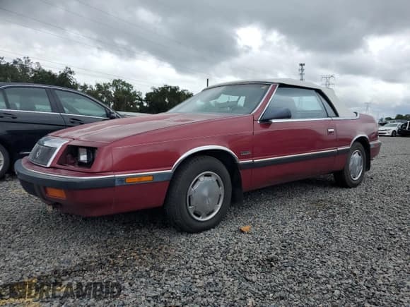 ✅ 1989 Chrysler LeBaron • VIN: 1C3XJ45J8KG223051 • Lot: 75115464. Listed on Copart with 27,923 mi. Free auction sales archive from the USA and detailed vehicle history report at DreamBid. Image 1.