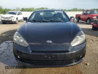 2008 Hyundai Tiburon GS с VIN KMHHM66D28U287992, выставлен на аукционе Copart как лот 55080195 с пробегом 125 922 миль миль и На запчасти • Non repairable. История ставок и продаж доступна на DreamBid. Изображение 5.