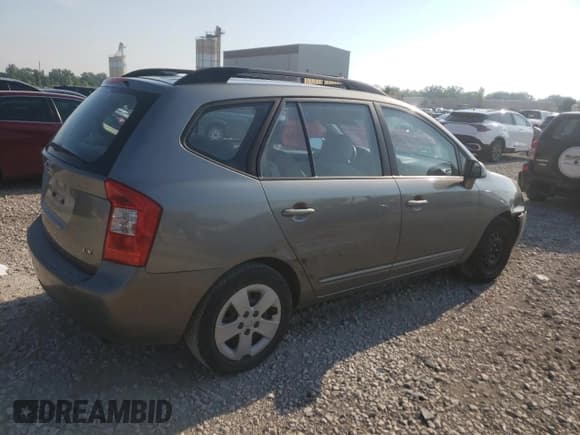 ✅ 2009 Kia Rondo LX • VIN: KNAFG528697282779 • Лот: 58926614. Опубликован ранее на Copart с пробегом 115 355 миль. Бесплатный доступ к архиву аукционных продаж из США и подробный отчёт об истории автомобиля на DreamBid. Изображение 3.